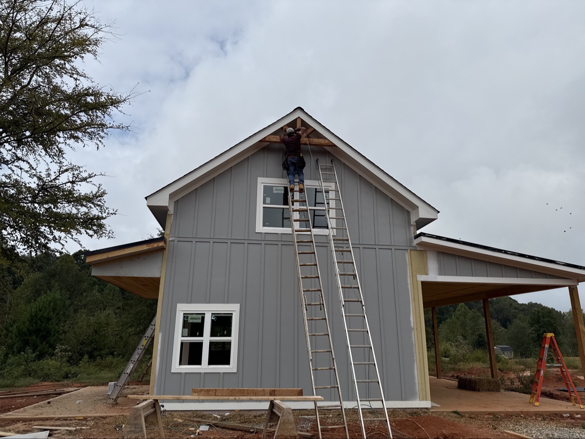 Installing trim on gable with board and batten siding